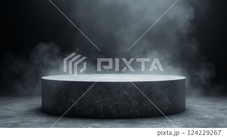 A platform of gray textured concrete with a haze in the darkness 124229267