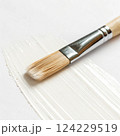 Paintbrush with white paint. 124229519