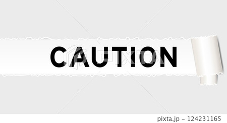 Ripped gray paper background that have word caution under torn part Ripped gray paper background that have word caution under torn part 124231165