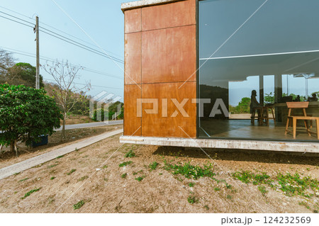 Modern cafe exterior with glass windows  124232569