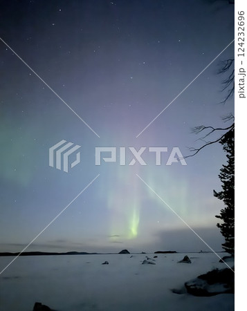 Inari, Finland, is located within the Arctic Circle and has a high chance of seeing the Northern Lights. 124232696