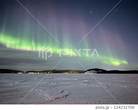 Inari, Finland, is located within the Arctic Circle and has a high chance of seeing the Northern Lights. 124232700