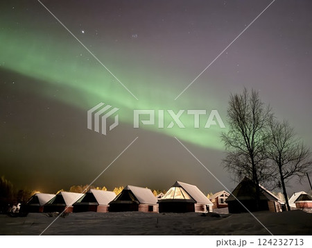 Inari, Finland, is located within the Arctic Circle and has a high chance of seeing the Northern Lights. 124232713