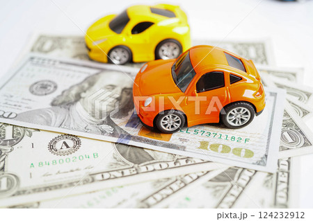 Bangkok, Thailand November 18, 2023 Car on banknote money, buying or insurance concept. Bangkok, Thailand November 18, 2023 Car on banknote money, buying or insurance concept. 124232912
