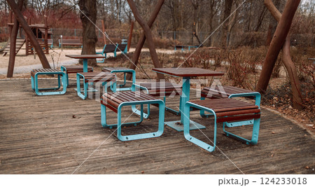 Outdoor Park Furniture with Wooden Tables and Metal Frames in Park Area Outdoor Park Furniture with Wooden Tables and Metal Frames in Park Area 124233018