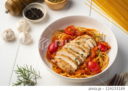 Grilled chicken breast with spaghetti tomato sauce in white plate Grilled chicken breast with spaghetti tomato sauce in white plate 124233189