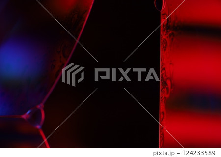 Red and purple fluid reflections on black background, liquid surface abstraction, colour edge, deep dark backgrounds, geometric water shapes, fluids movement, phenomenal physical features Red and purple fluid reflections on black background, liquid surface abstraction, colour edge, deep dark backgrounds, geometric water shapes, fluids movement, phenomenal physical features 124233589