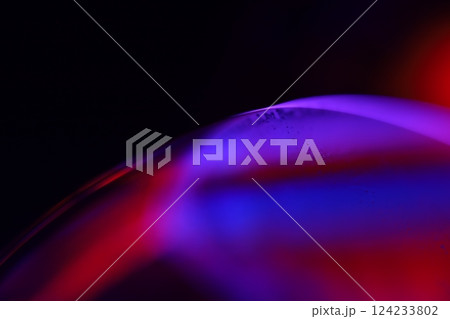 Red and purple fluid reflections on black background, liquid surface abstraction, colour edge, deep dark backgrounds, geometric water shapes, fluids movement, phenomenal physical features 124233802
