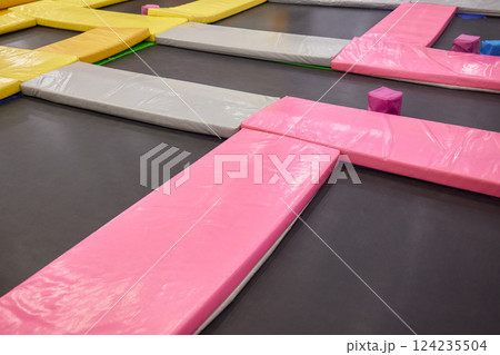 Set of trampolines at indoor play center playground. 124235504