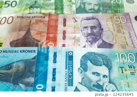 Stack of Norwegian krone and Serbian Dinar Stack of Norwegian krone and Serbian Dinar 124235645