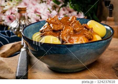Beef stew in gravy, served with silesian dumplings. 124237610