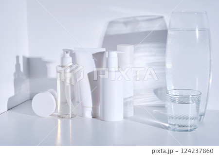 Set of cosmetic skin care products on white background with water reflections. 124237860