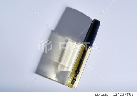 Bottle with brush filled with oil for eyebrow and eyelash growth. Bottle with brush filled with oil for eyebrow and eyelash growth. 124237863