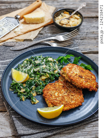 chicken patties with kale almond parmesan salad chicken patties with kale almond parmesan salad 124238471