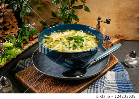 Broth - chicken soup in a bowl. 124238639