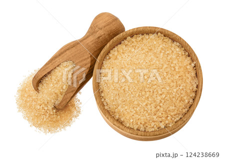 The brown sugar in wooden bowl and scoop isolated on white background. Top view. Flat lay The brown sugar in wooden bowl and scoop isolated on white background. Top view. Flat lay 124238669