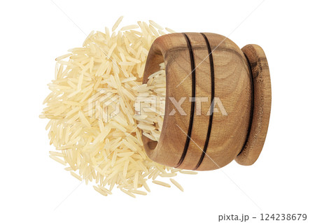 rice basmati in a wooden bowl isolated on white background. Top view. Flat lay rice basmati in a wooden bowl isolated on white background. Top view. Flat lay 124238679