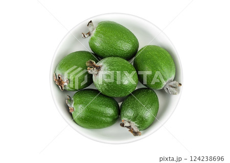 Feijoa fruit in a ceramic bowl isolated on white background 124238696
