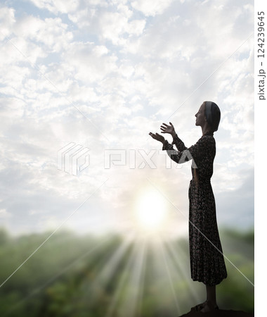 Young girl praying to God Young girl praying to God 124239645