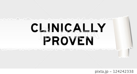 Ripped gray paper background that have word clinically proven under torn part 124242338
