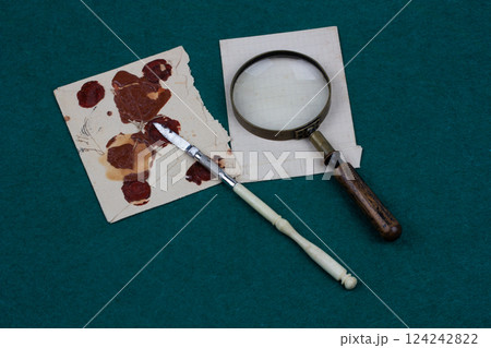 Retro envelope opener knife with magnifying glass and vintage letter envelope Retro envelope opener knife with magnifying glass and vintage letter envelope 124242822