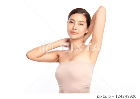 Beautiful Young Asian woman Raises her hands to Showcase clean and hygienic underarms Against a white background, Smooth armpit cleanliness and protection concept Beautiful Young Asian woman Raises her hands to Showcase clean and hygienic underarms Against a white background, Smooth armpit cleanliness and protection concept 124245920
