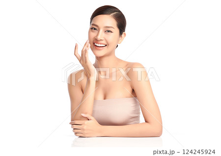 A beautiful young Asian woman with clean, fresh skin against a white background. Skincare, facial treatment, cosmetology, beauty, and spa. An elegant portrait of an Asian woman. A beautiful young Asian woman with clean, fresh skin against a white background. Skincare, facial treatment, cosmetology, beauty, and spa. An elegant portrait of an Asian woman. 124245924