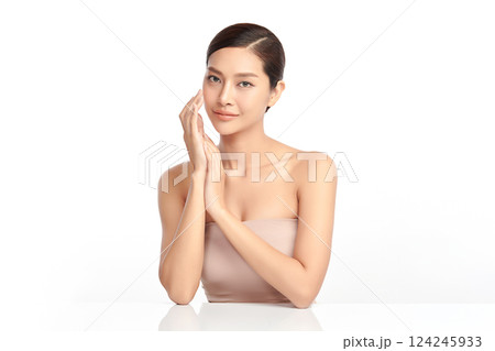 A beautiful young Asian woman with clean, fresh skin against a white background. Skincare, facial treatment, cosmetology, beauty, and spa. An elegant portrait of an Asian woman. A beautiful young Asian woman with clean, fresh skin against a white background. Skincare, facial treatment, cosmetology, beauty, and spa. An elegant portrait of an Asian woman. 124245933