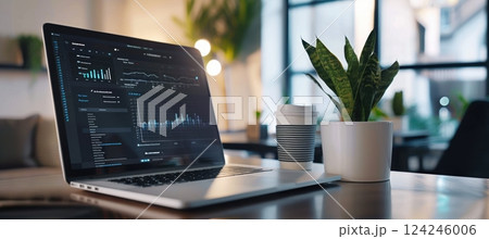 Modern Office with Digital Project Management Dashboard on Laptop for Efficient Team Collaboration 124246006