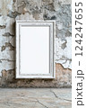 Rustic White Frame on Grungy Wall Background for Art Display 124247655