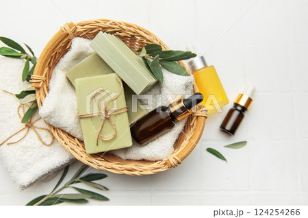 Natural olive soap and essential oil creating relaxing spa atmosphere Natural olive soap and essential oil creating relaxing spa atmosphere 124254266