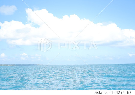 a serene seascape with a vast expanse of blue ocean stretching toward the horizon 124255162