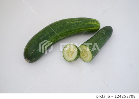 Cucumber and slices on a white background. Selective focus. 124255709