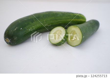 Cucumber and slices on a white background. Selective focus. 124255713