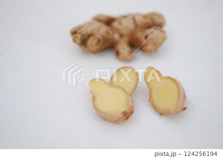 Turmeric (Curcuma longa Linn) rhizome (root) sliced isolated on white background. Turmeric (Curcuma longa Linn) rhizome (root) sliced isolated on white background. 124256194
