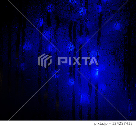 Background of misted glass. Christmas lights 124257415
