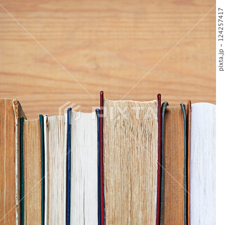 Old books on shelf. Ancient background Old books on shelf. Ancient background 124257417