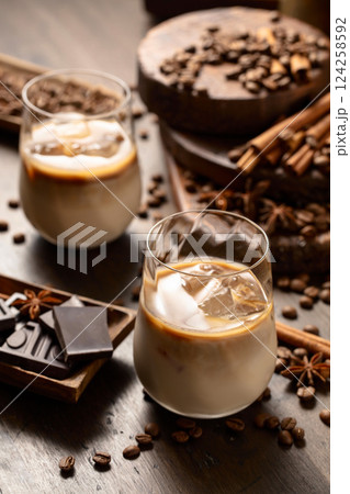 Cream and coffee cocktail in glasses with ice. Cream and coffee cocktail in glasses with ice. 124258592