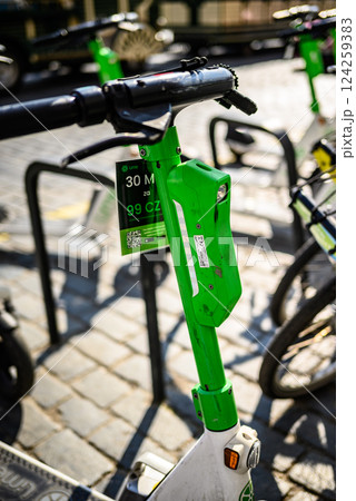 Lime electric scooter for rent parked in historic centre of Prague, capital of Czech Republic Lime electric scooter for rent parked in historic centre of Prague, capital of Czech Republic 124259383