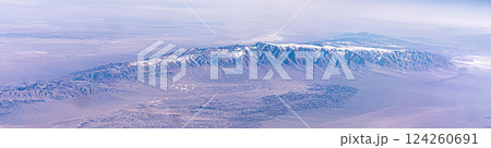 Kunlun Mountain Range in the Tibetan Plateau in China. Panorama of snow-capped mountains in the Himalayas airplane view 124260691