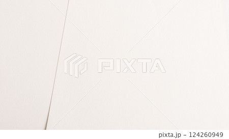 White and beige paper background with a creamy texture and thin vellum finish. Warm off-white tones 124260949