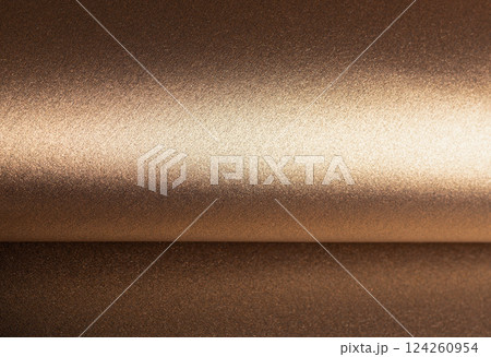 Warm gold and bronze paper background with a pearlescent, metallic texture and shimmering effect. Warm gold and bronze paper background with a pearlescent, metallic texture and shimmering effect. 124260954