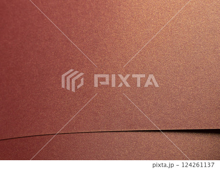 Burgundy paper background with a glossy, pearlescent texture and shimmering metallic finish. Rich, Burgundy paper background with a glossy, pearlescent texture and shimmering metallic finish. Rich, 124261137