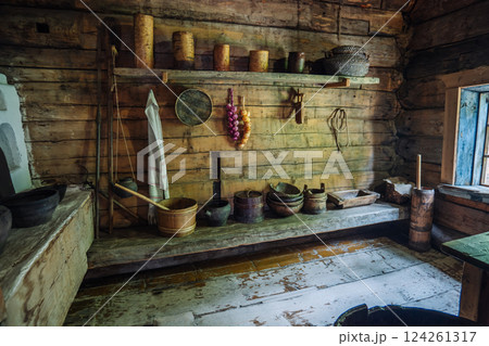 Ancient wooden kitchen in a rural house in russia, displaying traditional tools and utensils, evoking a historical lifestyle 124261317