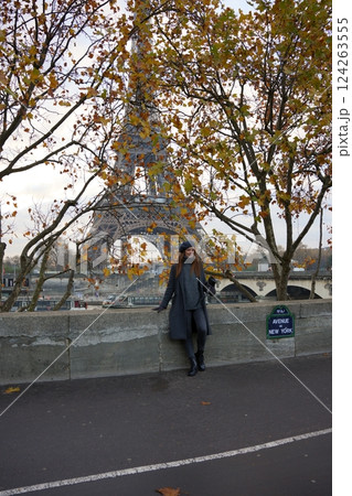 Chic Parisian Woman in Beret Poses Near Avenue De New York and Eiffel Tower Chic Parisian Woman in Beret Poses Near Avenue De New York and Eiffel Tower 124263555