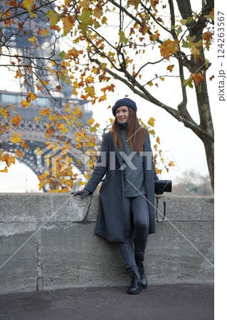 Stylish Autumn Woman in Coat and Beret by Eiffel Tower and Avenue De New York Stylish Autumn Woman in Coat and Beret by Eiffel Tower and Avenue De New York 124263567