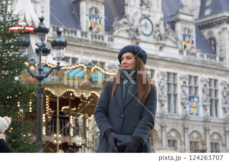 Parisian Girl in Beret and Gray Coat by Hotel de Ville in Autumn Parisian Girl in Beret and Gray Coat by Hotel de Ville in Autumn 124263707