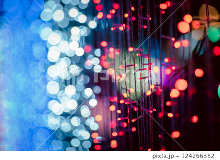 Abstract colorful bokeh orbs on dark background, vibrant defocused light dots pattern Abstract colorful bokeh orbs on dark background, vibrant defocused light dots pattern 124266382