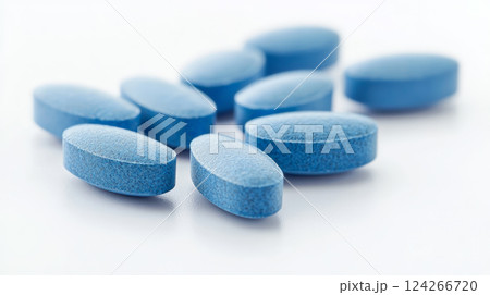 A close-up of a single blue vitamin tablet set against a clean white background. Generative AI 124266720