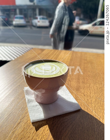 Matcha Latte Art In a ceramic cup with matcha powder in restaurant Matcha Latte Art In a ceramic cup with matcha powder in restaurant 124267065